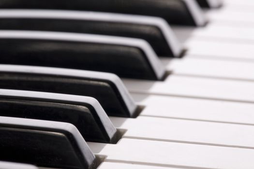 Keyboard extending to the horizon on a close up image of a synthesizer.