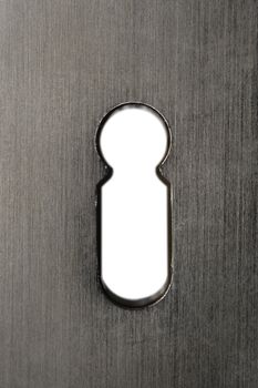 Macro image of a keyhole in a metal door.  Clipping path included for keyhole so you can add your own image in behind.
