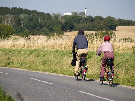 Family cyclists bicycles fun ride outdoors in nature