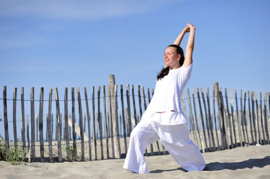 Woman doing stretching on the beach