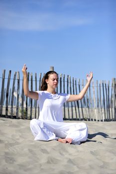 Woman doing stretching on the beach