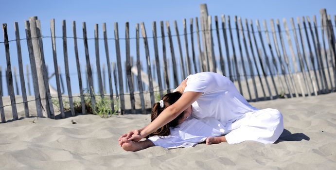 Woman doing stretching on the beach