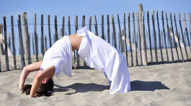 Woman doing stretching on the beach