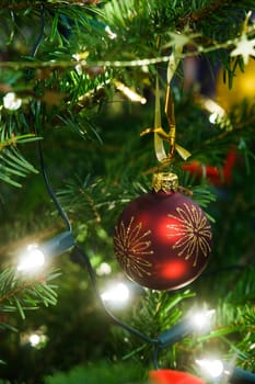 Christmas ball and garland on the fir tree
