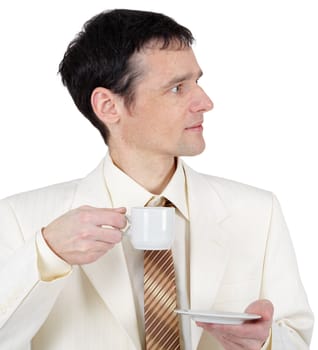 Young man in a business suit with a cup of coffee