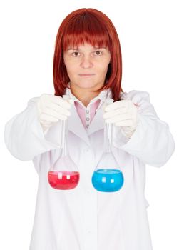 The woman - a scientist holding a flasks with colored liquids