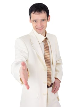 Friendly young man in a business suit on white background