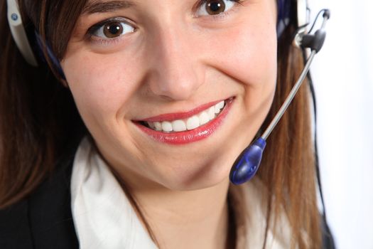 Smiling telephone operator - close-up