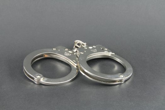 Hand cuffs isolated with copy space.