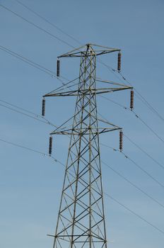 A electrical pylon with a blue sky
