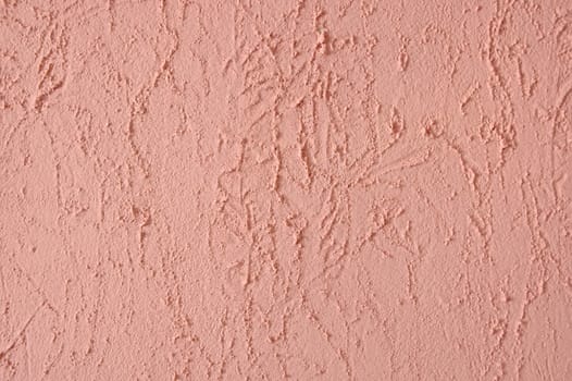 Brightly coloured pink stucco wall. For texture or background.