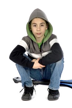 a boy sitting on a waveboard on white