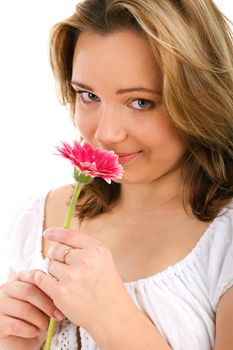 Portrait of lovely girl holding fresh pink herbera