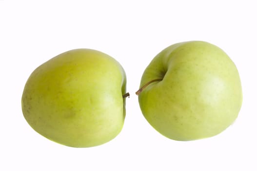 two organic green apples, isolated on white background