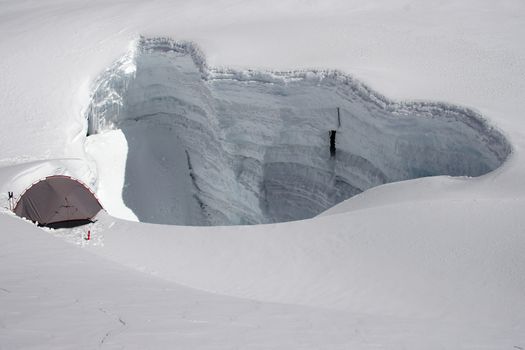 Hiding from strong wind near crevasse at 5300m, Cordillera Blanca, Peru