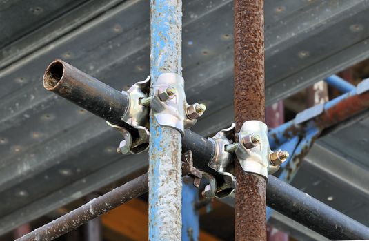 Detail of scaffolding with pipes and holdfasts