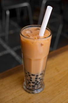 A glass of bubble tea on table.