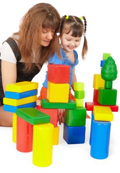 Mother and daughter playing with colored toys on a white background