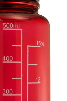 double scale in mililiters and fluid ounces on a red drinking bottle, isolated on white