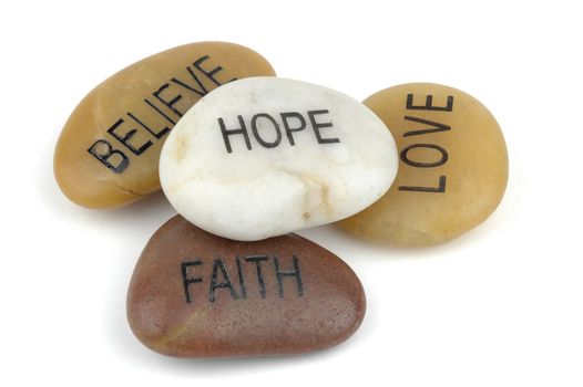 Pile of stones carved with inspirational words.