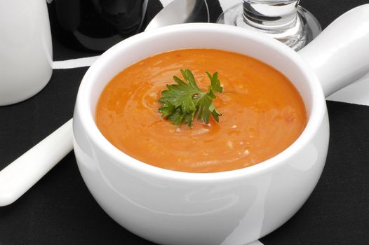 Bowl of hearty roasted red pepper soup.