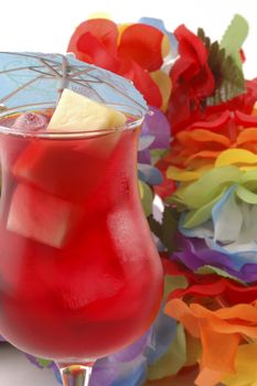 Red refreshing cold drink on a colorful background.