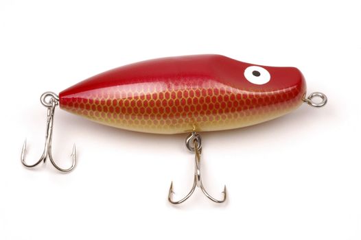 Red fishing lure on a white background.