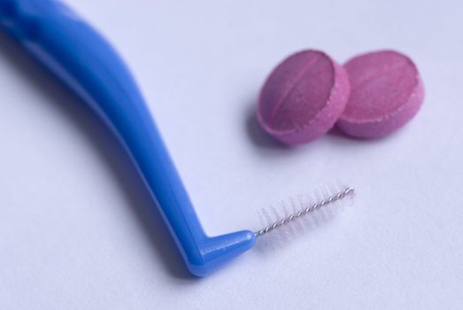 interdental tooth brush and disclosing tablet