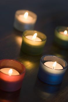 a set of 5 tea light candles with a narrow depth of focus, representation of Diwali