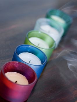 5 smoking candles just after being blown-out