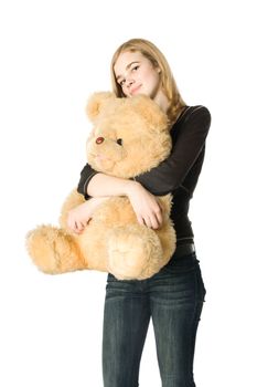 Young girl hugging a Teddy bear, isolated