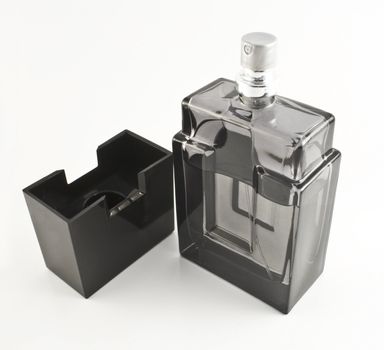 Black perfume bottle isolated on white background