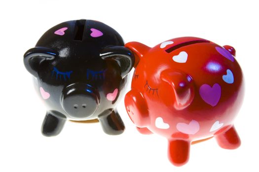 Couple of pigs moneyboxes isolated on a white background.