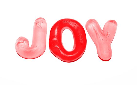 the word joy spelt with red and pink jellies