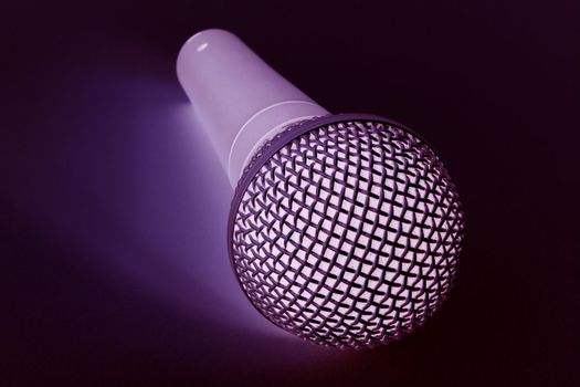 blue coloured mic over a black background