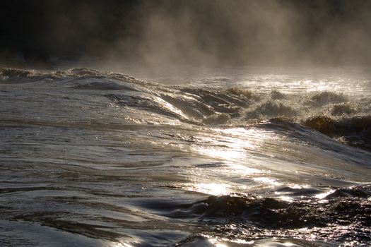 august foggy morning: river, foam; splashes
