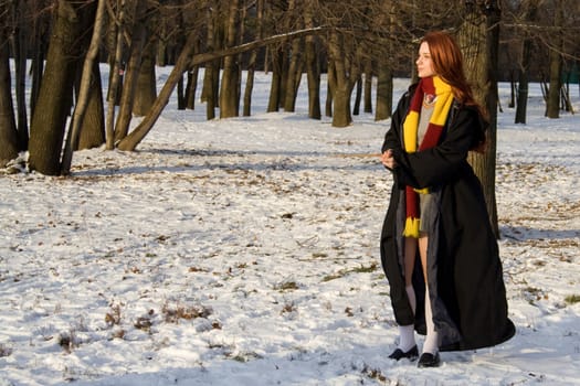 winter morning: girl standing near college 
