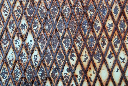 Rusty metal texture or background with diamond pattern