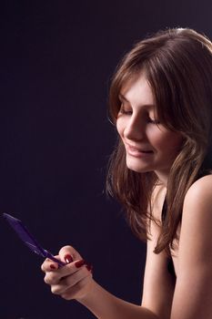 lady in black handing mobile phone
