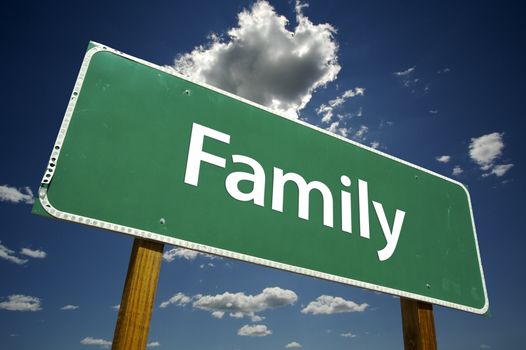 Family Road Sign with dramatic clouds and sky.
