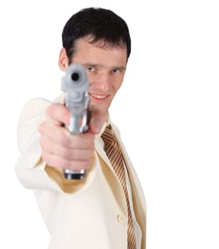 A young man in a white suit with a pistol shooting