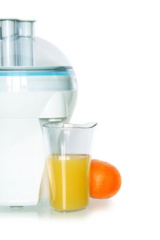 Modern electric juicer and glass of orange juice isolated on white background with clipping path