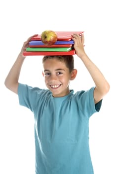 a smiling boy with five books on his head and a falling apple