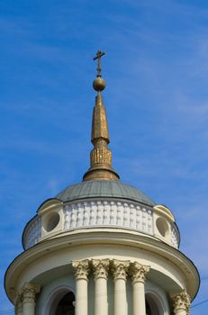 Dome with cross of belltower of a temple of Prelate Martin the Confessor, the Pope