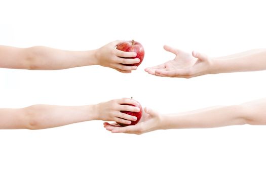 Girls passing red apple on each other (close up)