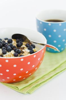 Breakfast blueberry yoghurt with coffee cup
