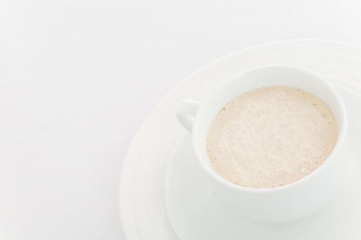 White coffee  (latte) cup over a white background