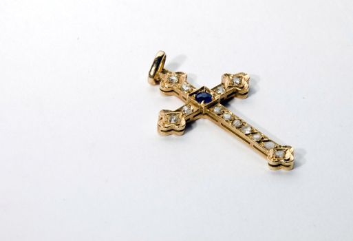 Antique 24ct gold crucifix pendant with inset sapphire and diamonds