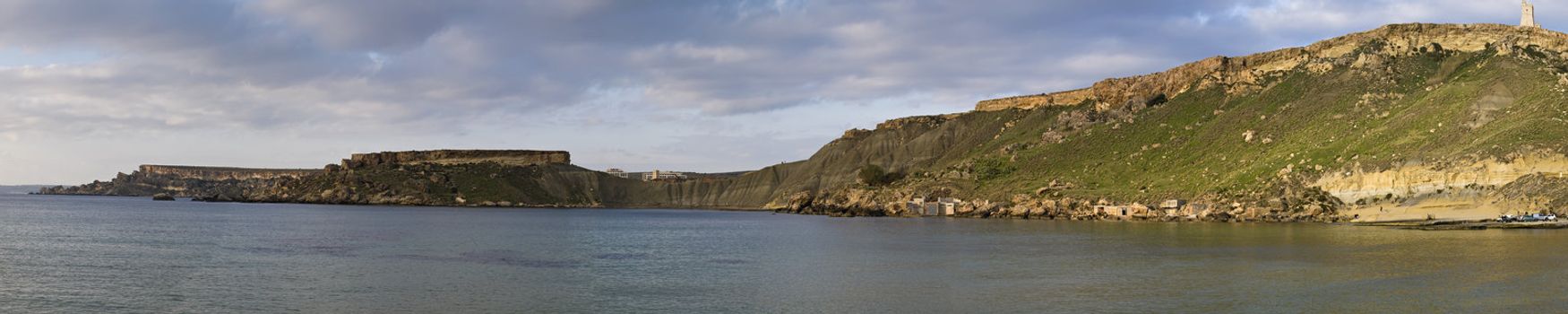 Panoramic view of Gnejna Bay in Malta just before sunset