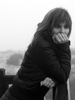 Monochrome image showing a woman in a pensive mood